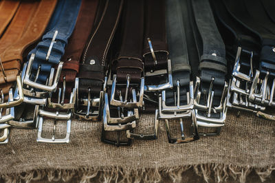 Close-up of belts on burlap