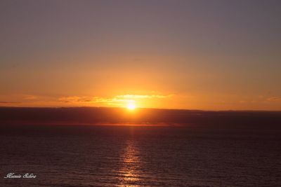 Scenic view of sea at sunset