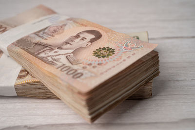 Close-up of banknote bundle on table