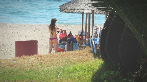 People relaxing on beach