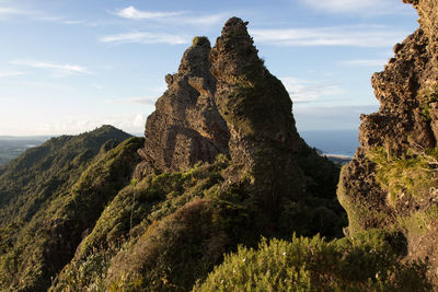 Rock formations on landscape against sky