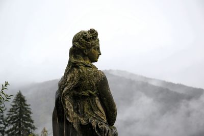 Low angle view of statue against sky
