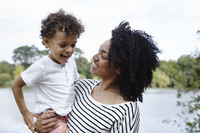 Mother with son at water