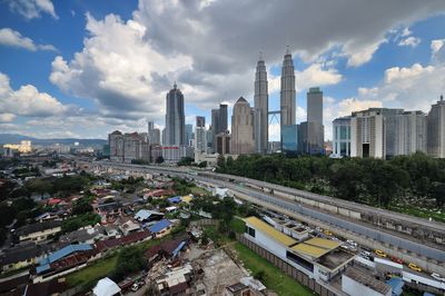 Aerial view of cityscape against sky