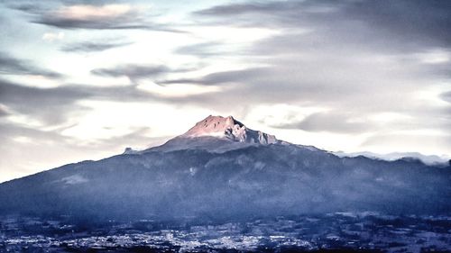 Scenic view of snowcapped mountains against sky