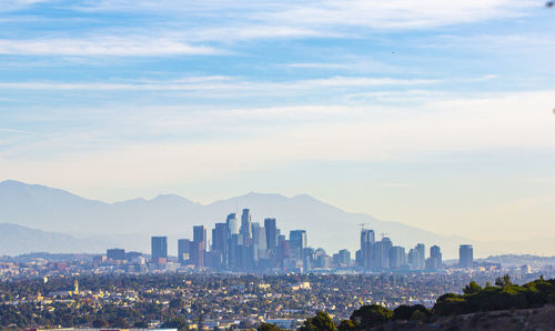 Modern buildings in city against sky