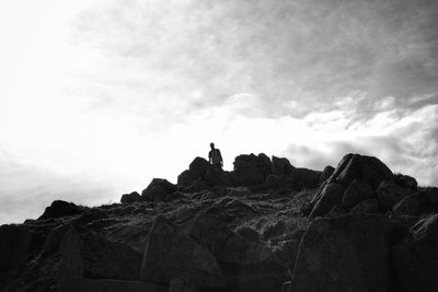 Low angle view of rock formations against sky