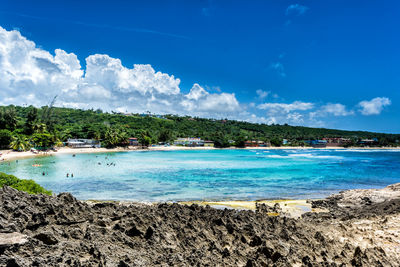 View of calm sea against cloudy sky