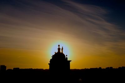 Silhouette of temple against sky during sunset