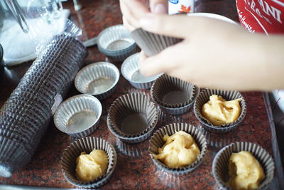 Midsection of person preparing food on table