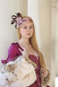 Portrait of young woman in costume with long hair during carnival