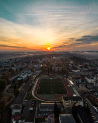 High angle view of city at sunset