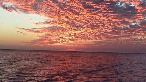 Scenic view of sea at sunset