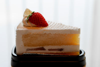 Close-up of dessert in glass against white background