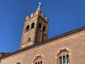 Low angle view of building against blue sky