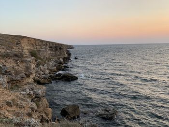 Scenic view of sea against clear sky during sunset