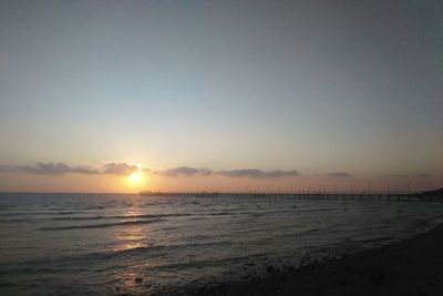 Scenic view of sea against clear sky during sunset