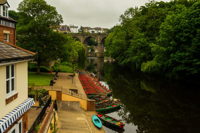 Arch bridge over river against sky