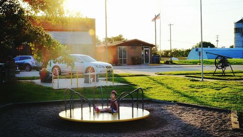 Vehicles on road along buildings