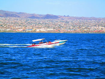 Scenic view of sea against blue sky