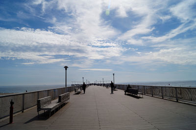 Scenic view of pier over sea against sky