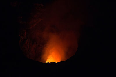 Scenic view of illuminated mountain against sky at night