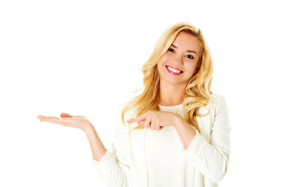 Portrait of a smiling young woman over white background