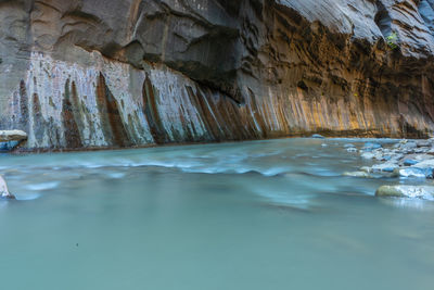 Low angle view of cave in sea