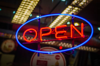 Illuminated open sign at restaurant