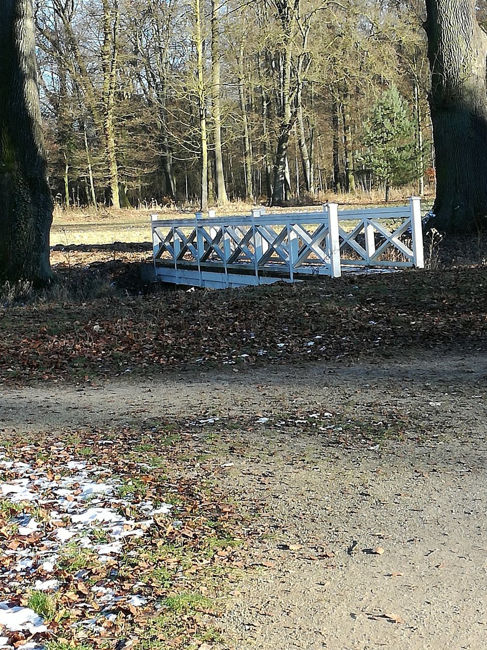 CLOSE-UP OF ROAD AGAINST WATER