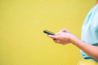 Close-up of woman using mobile phone