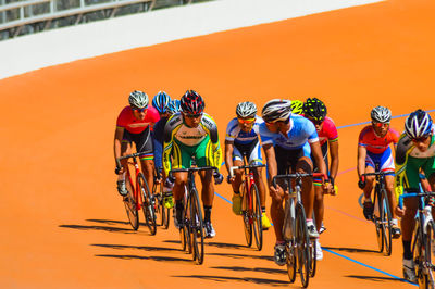 Group of people riding bicycle