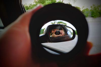 Portrait of man photographing camera