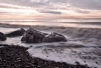 Scenic view of sea against sky during sunset