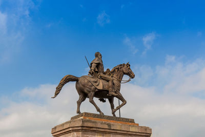 Low angle view of statue against sky