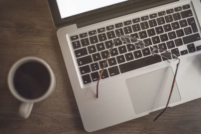 High angle view of coffee cup on table