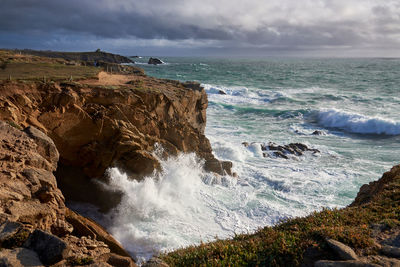 Waves of the atlantic ocean break on the coast rock with splashing gout on quiberon in france 