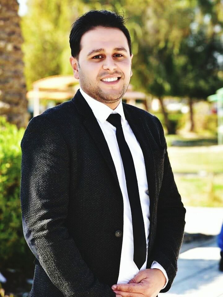 only men, men, one man only, suit, handsome, adult, adults only, businessman, one person, well-dressed, business, one young man only, young adult, lifestyles, formalwear, human body part, beautiful people, people, beard, portrait, corporate business, outdoors, wedding ceremony, cheerful, smiling, day, nature