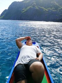 High angle view of man on boat in sea