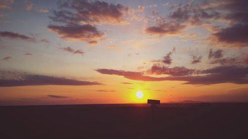 Scenic view of sea at sunset