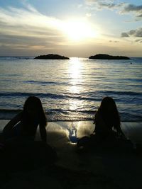 Silhouette of people on beach