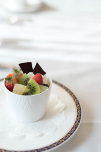 Bowl of fruit salad with ice cream