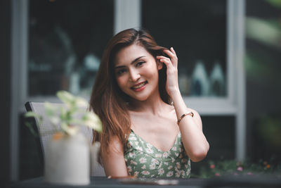 Portrait of smiling young woman outdoors