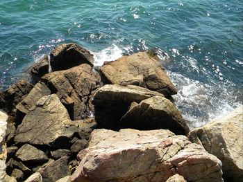 High angle view of rock formation in sea