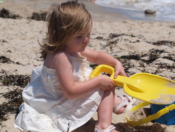 Girl playing on beach