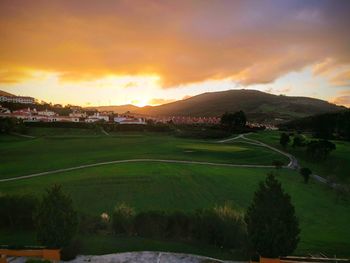 Scenic view of landscape against sky during sunset