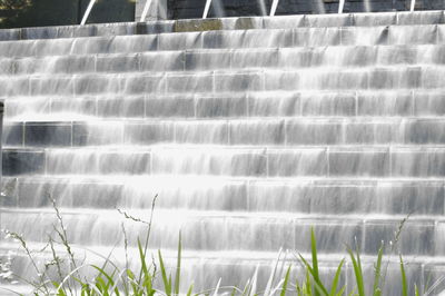 Scenic view of water flowing on dam