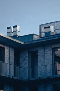 Low angle view of building against clear blue sky