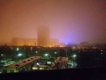 High angle view of illuminated buildings in city at night