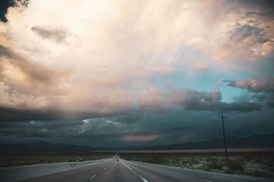 A long straight road through the desert of nevada